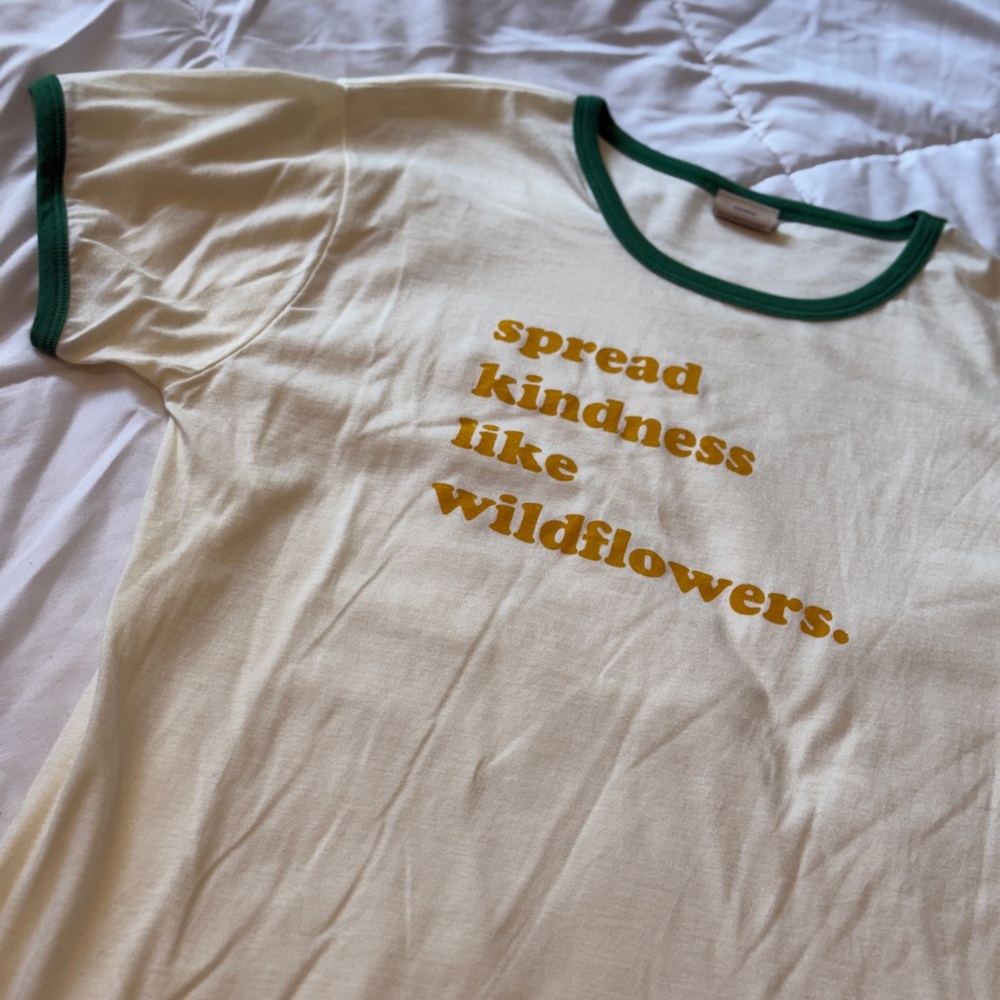 Cream Tee with Green Trim and Yellow Text